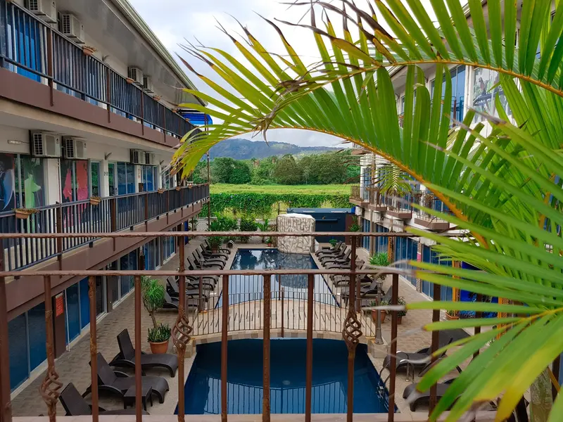 Room balconies overlooking the pool and the greenery