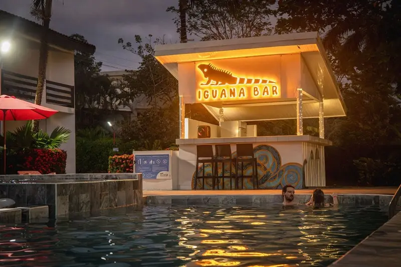 Iguana Bar by the pool, lit up at night